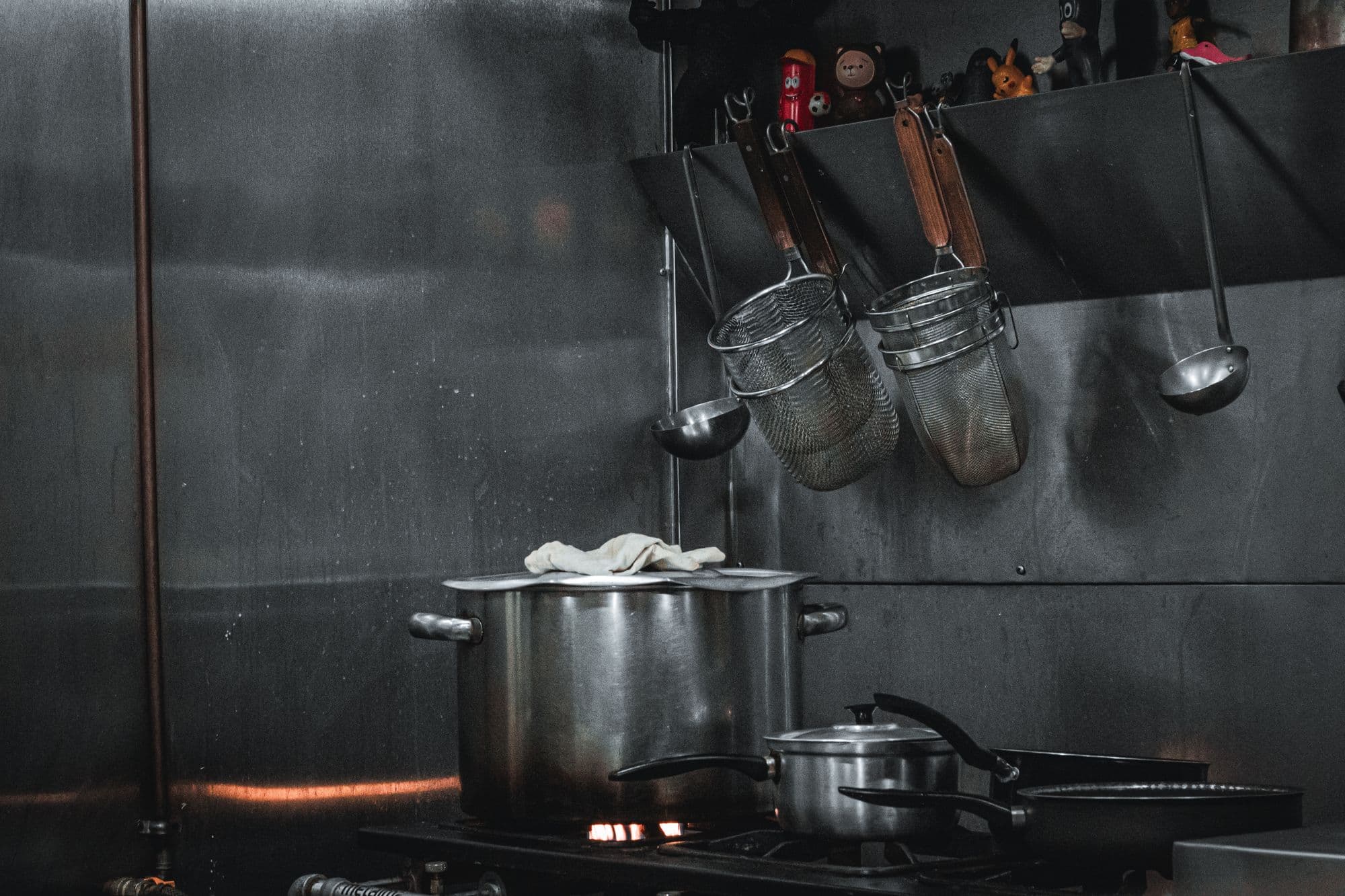 Cooking line and stainless steel equipment in a working commercial kitchen